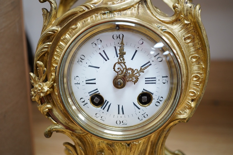 A late 19th century French ormolu mantel clock and another clock in an alabaster case, 39cm. Condition - fair to good